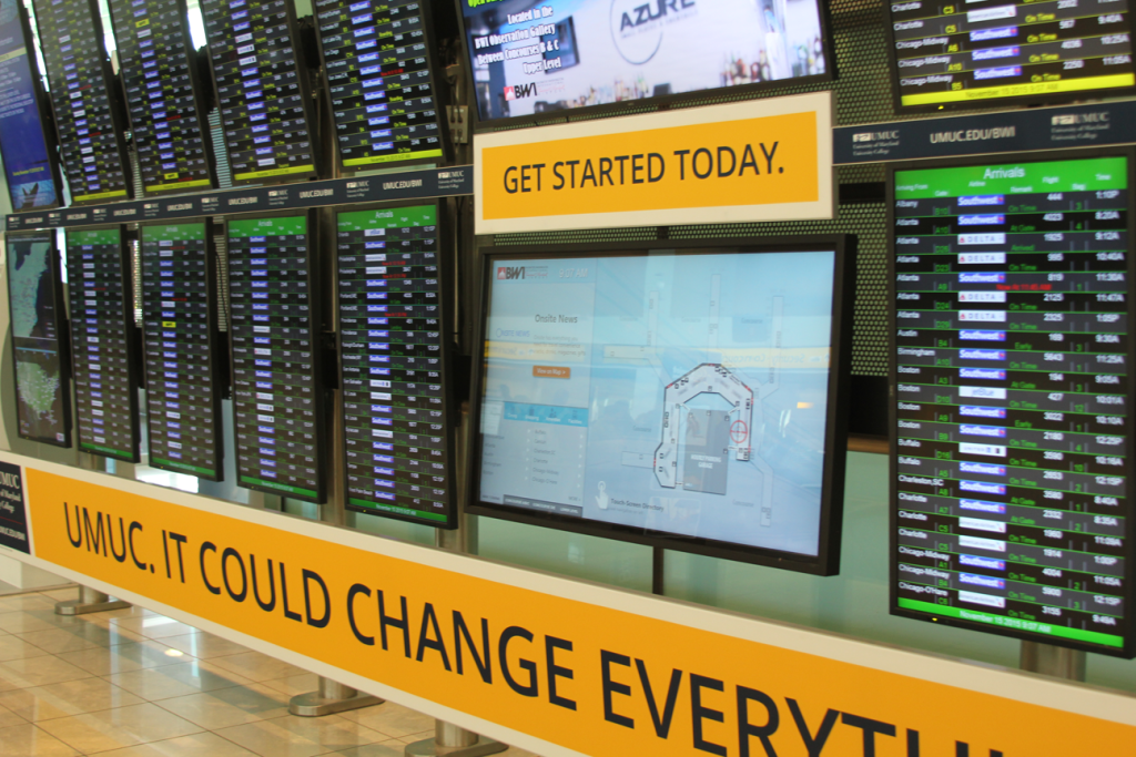 Wide view of BWI International Airport Interactive Digital Sign in the midst of existing FIDS display
