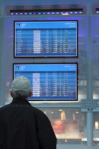 Passenger looking at FIDS screens