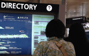 Old terminal directory with tape over stores that were no longer open