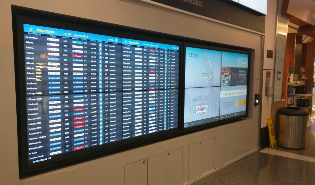 Flight information on the left wayfinding on the right in Terminal A at Boston Logan Airport (BOS)